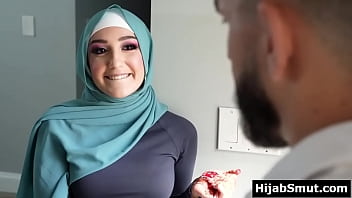 A young Muslim woman receives instruction from her soccer coach in sexual activities